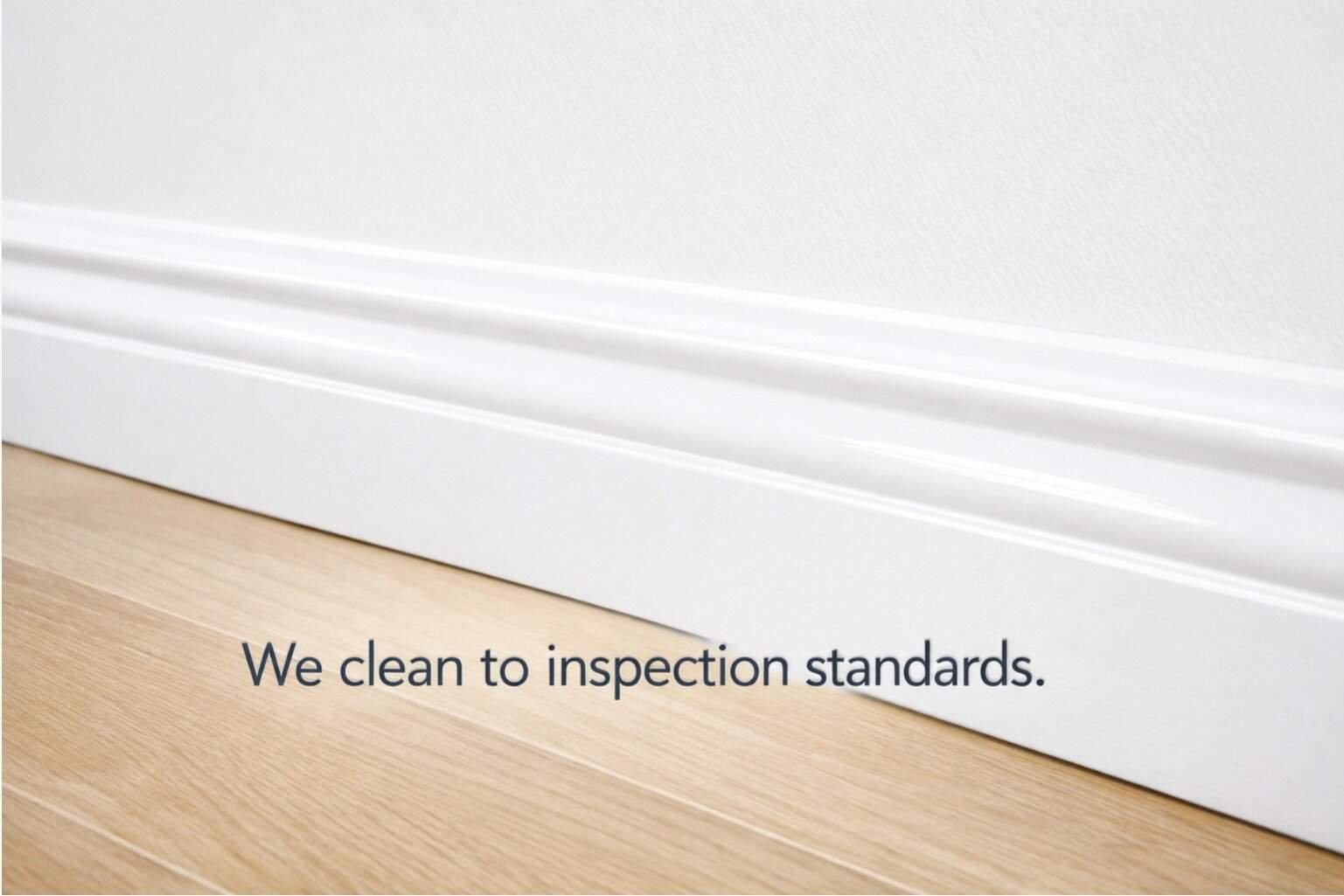 Deep cleaning results: Clean white baseboards and wood floors, showcasing effective deep cleaning for Google Ads campaign.